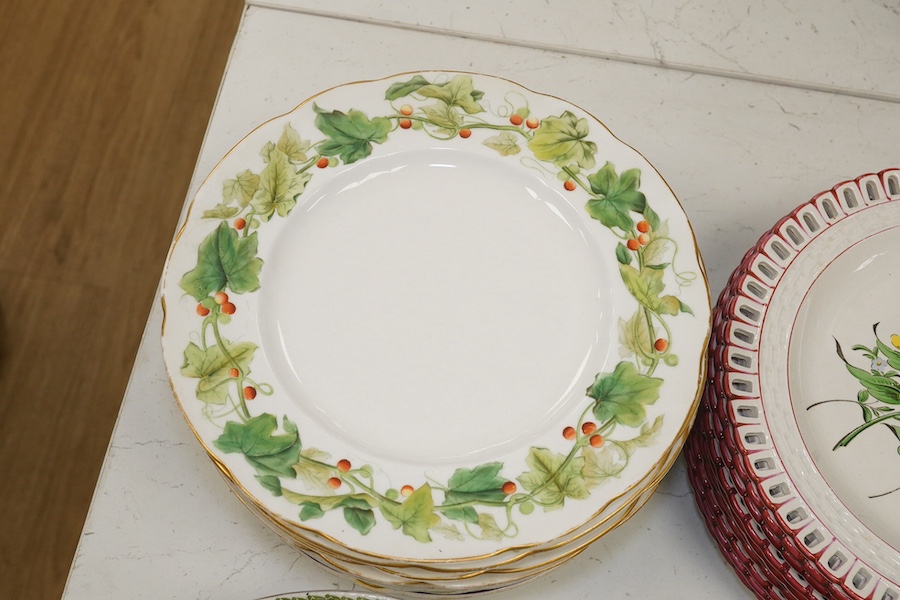 Ten French Luneville floral plates, a hand painted basket edged plate and various part dinner service plates, 24cm in diameter. Condition - mostly fair to good